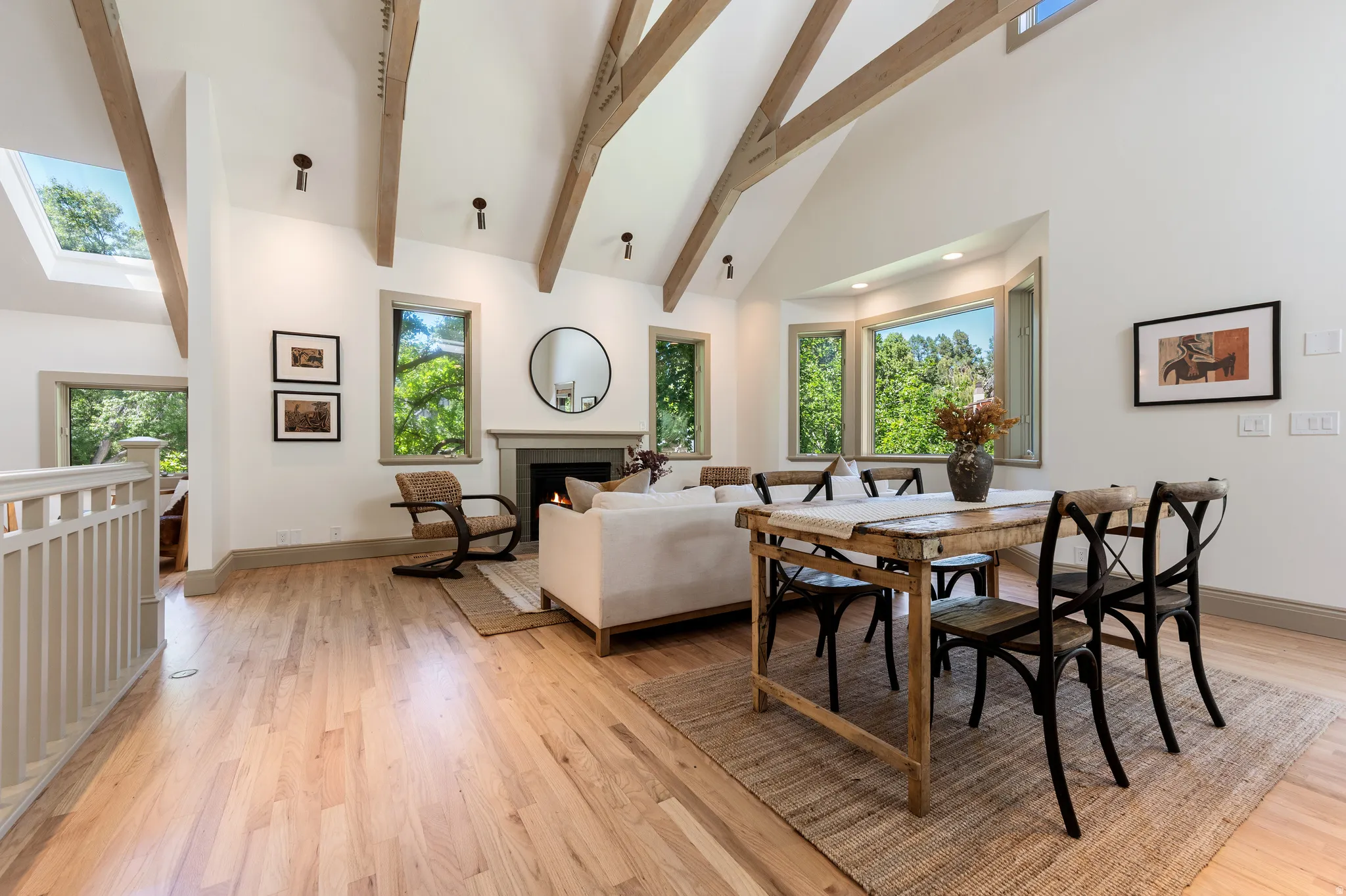 Vaulted ceilings with exposed wood beams define this open concept living space