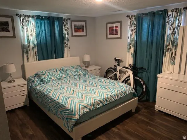 Bedroom featuring wood-finish flooring