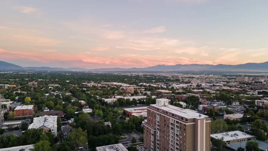 Expansive aerial perspective showcasing a city landscape with distant mountains