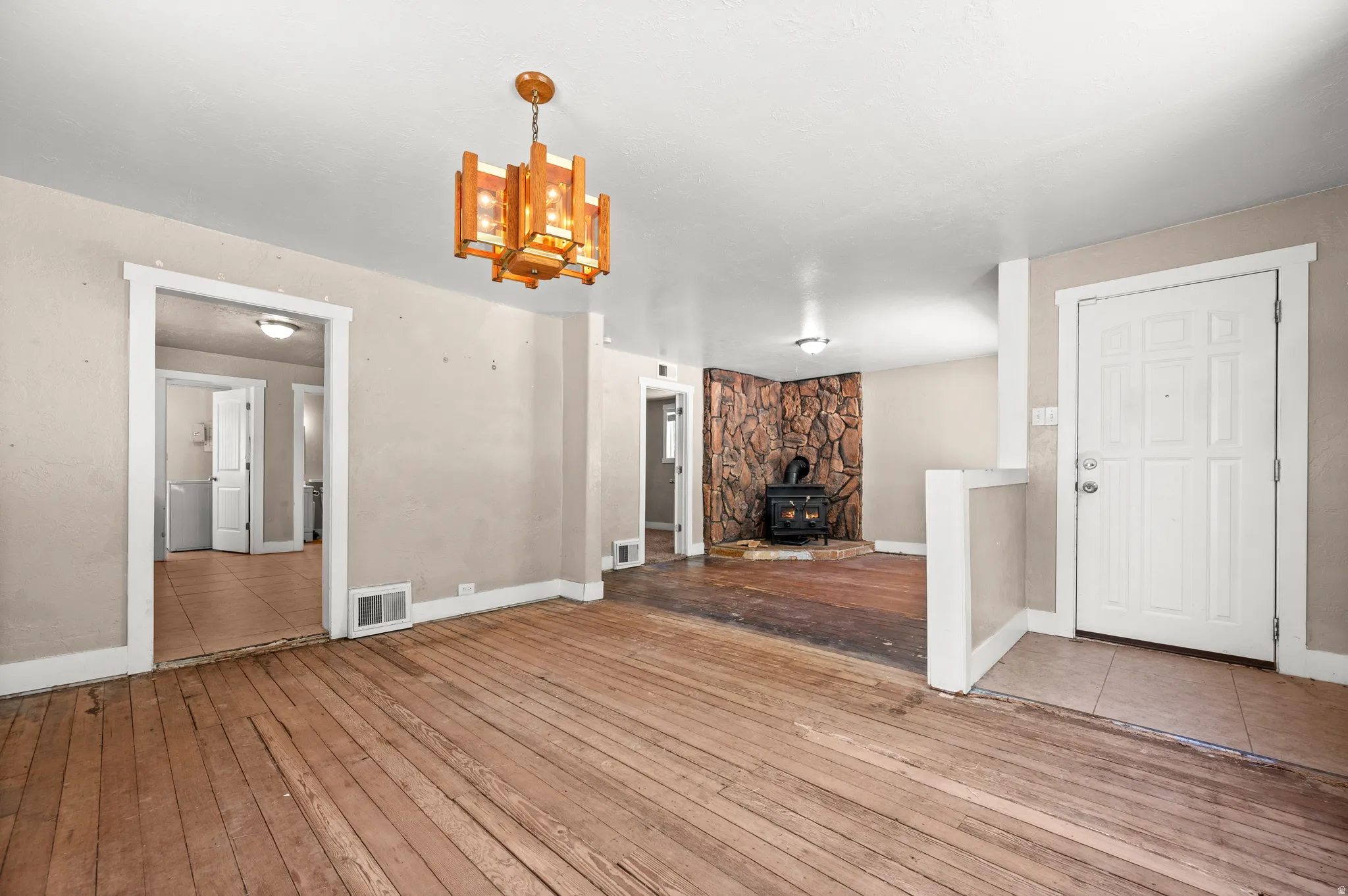 Exposed wood-finish flooring in a bright interior space