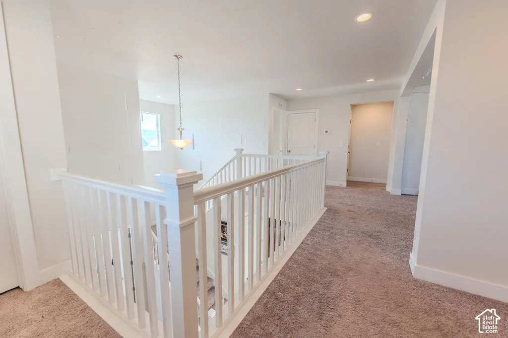 Gorgeous balustrade staircase looking down into main level