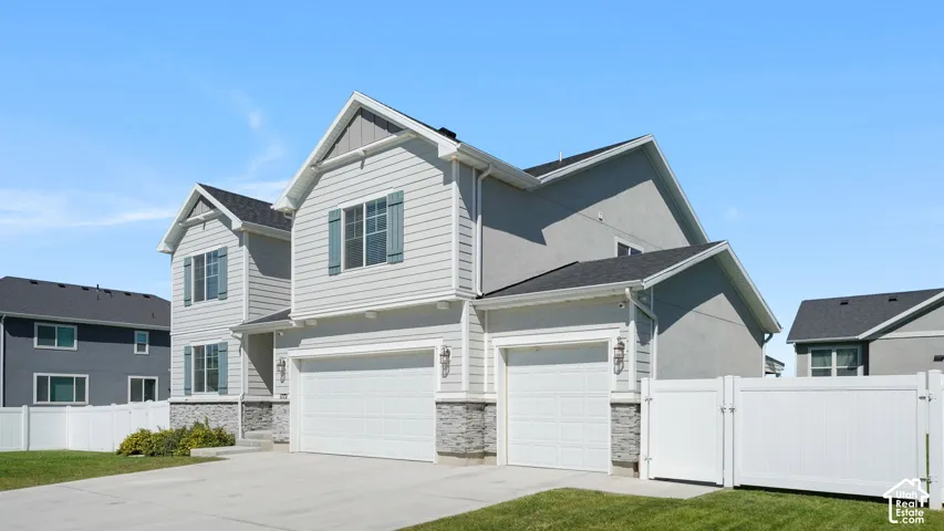 MAIN HOUSE IS FULLY FENCED & FEATURES A THREE CAR GARAGE & LOTS OF EXTERIOR NIGHT LIGHTING!