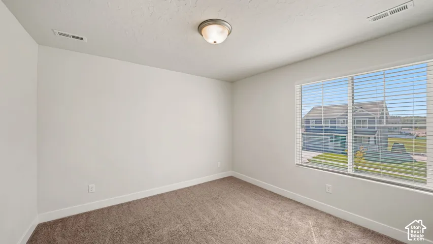 BEDROOM 2 of 5 with a large VIEW window & Walk-in closet