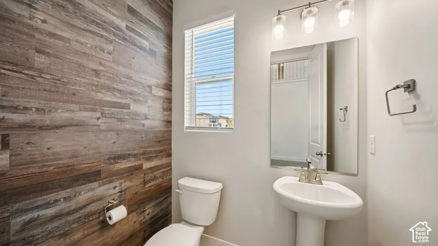 Guest Bath on main level w/Pedestal sink with brushed nickel faucet