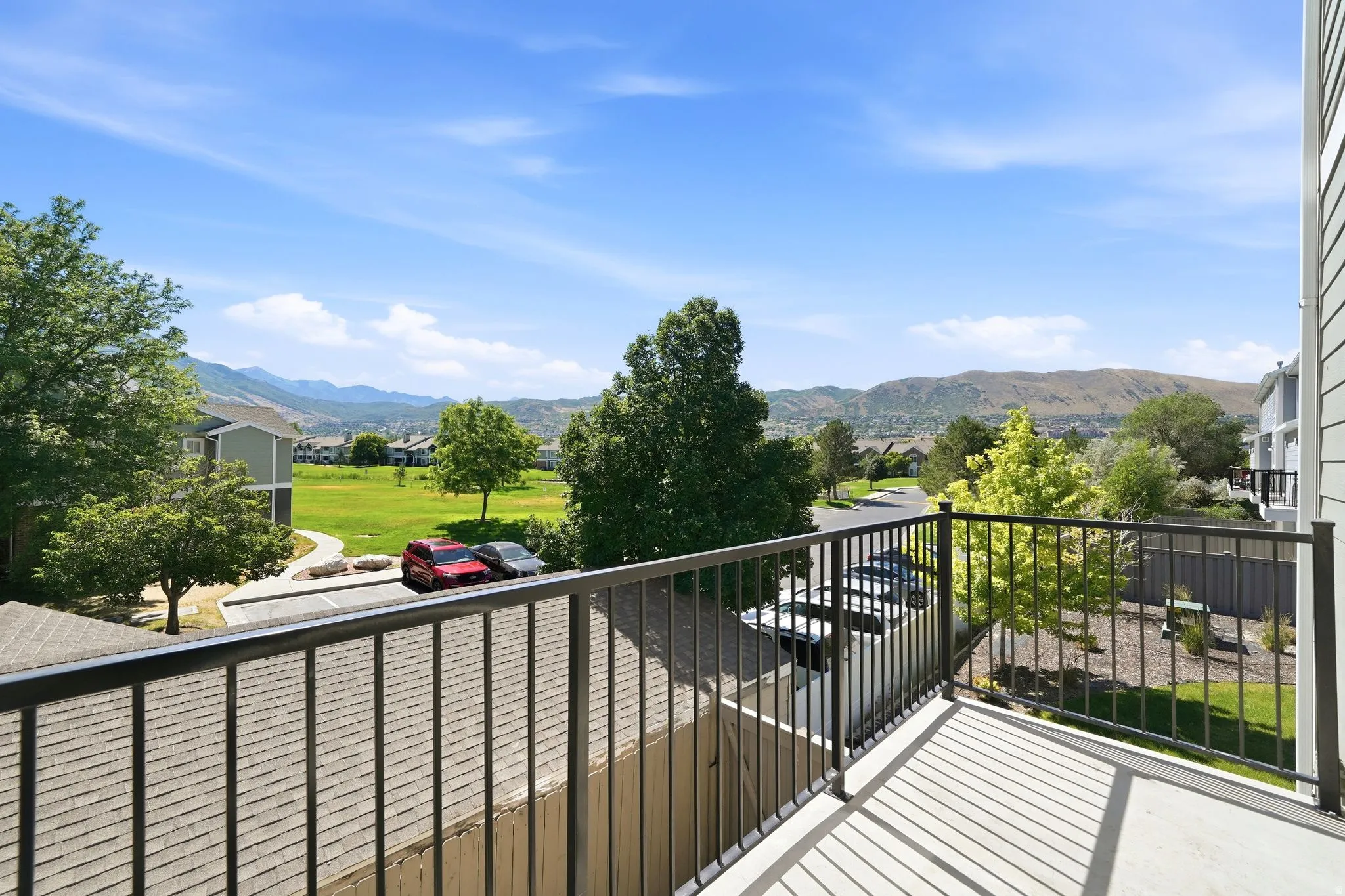 Outdoor balcony featuring a metal railing and concrete flooring