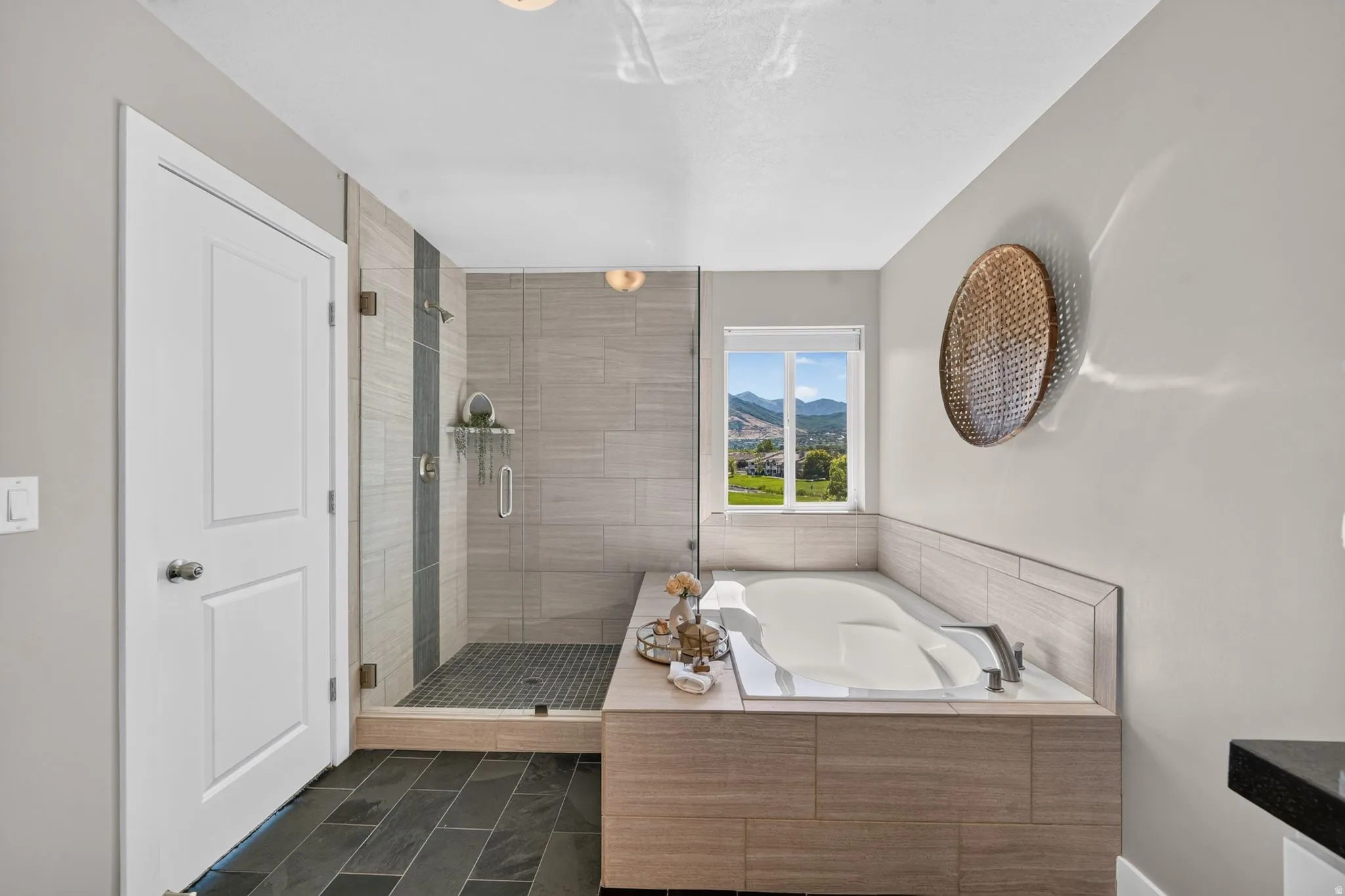 Contemporary bathroom with dark slate flooring