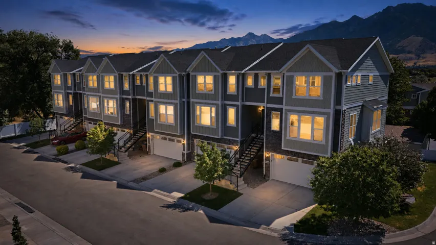 Contemporary townhome exteriors featuring multiple gables and varied siding textures