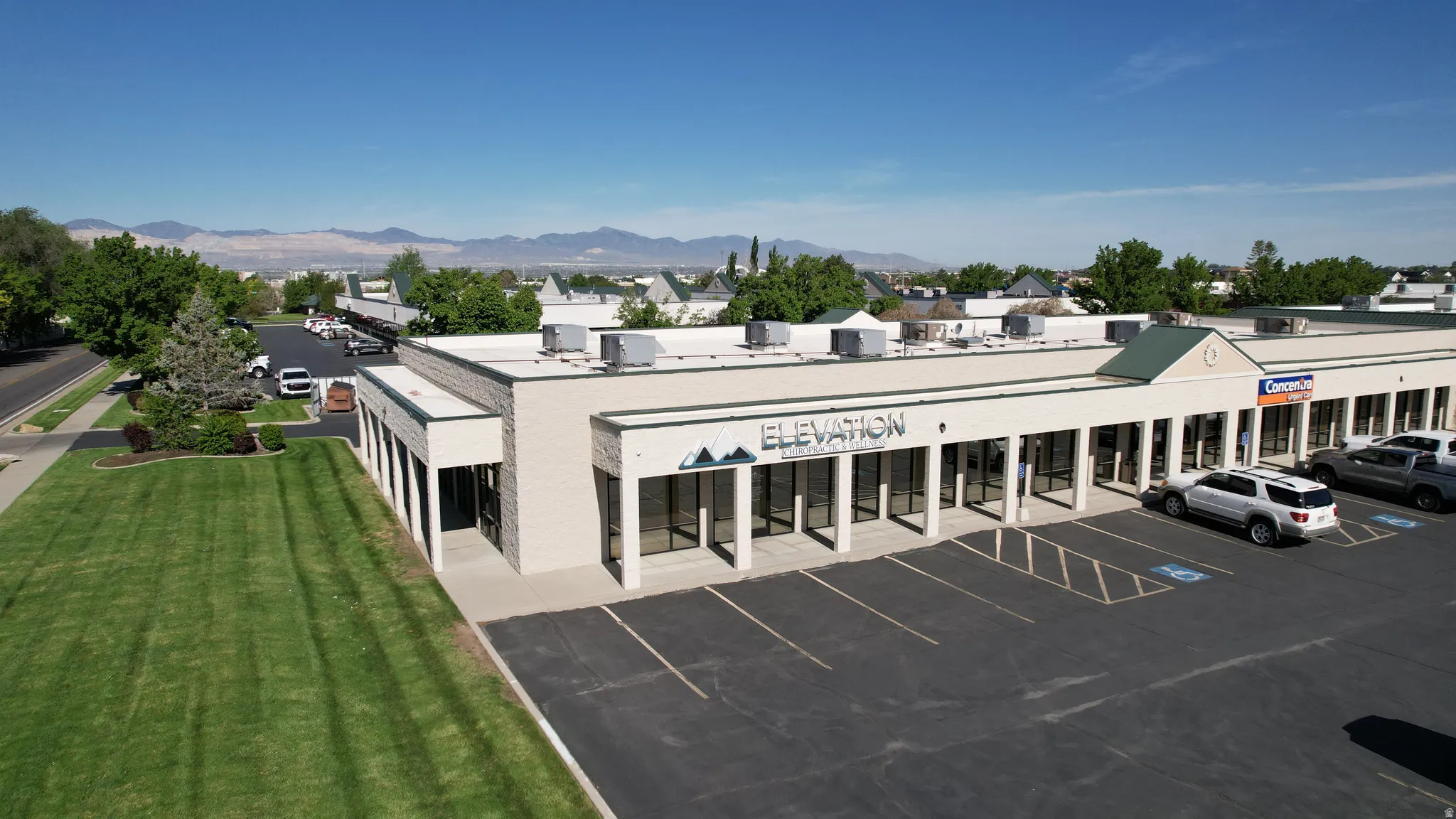 Single-story commercial building featuring multiple storefronts with large display windows