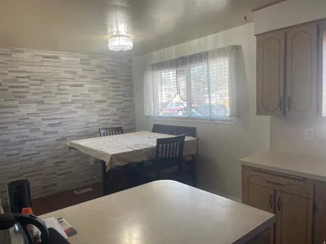 Tile accent wall with a crystal chandelier