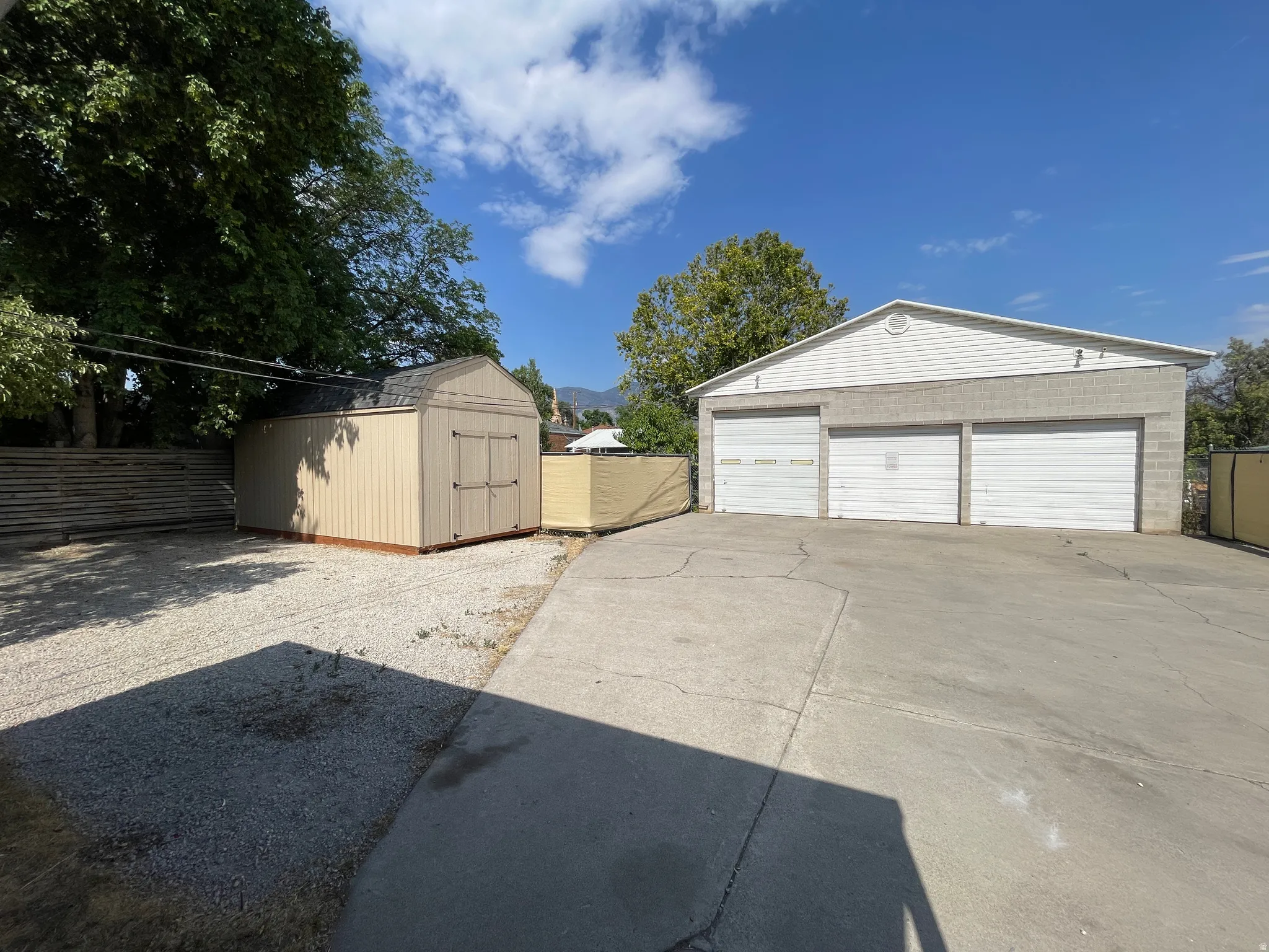 Three-bay garage with concrete block construction and gabled roofline