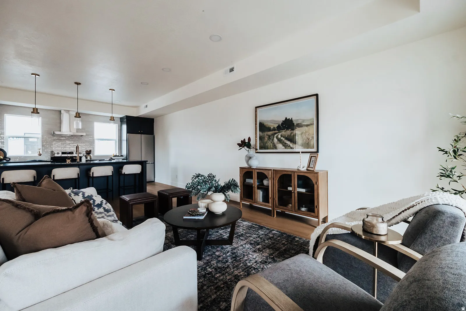 Open-concept living area featuring wood-finish flooring