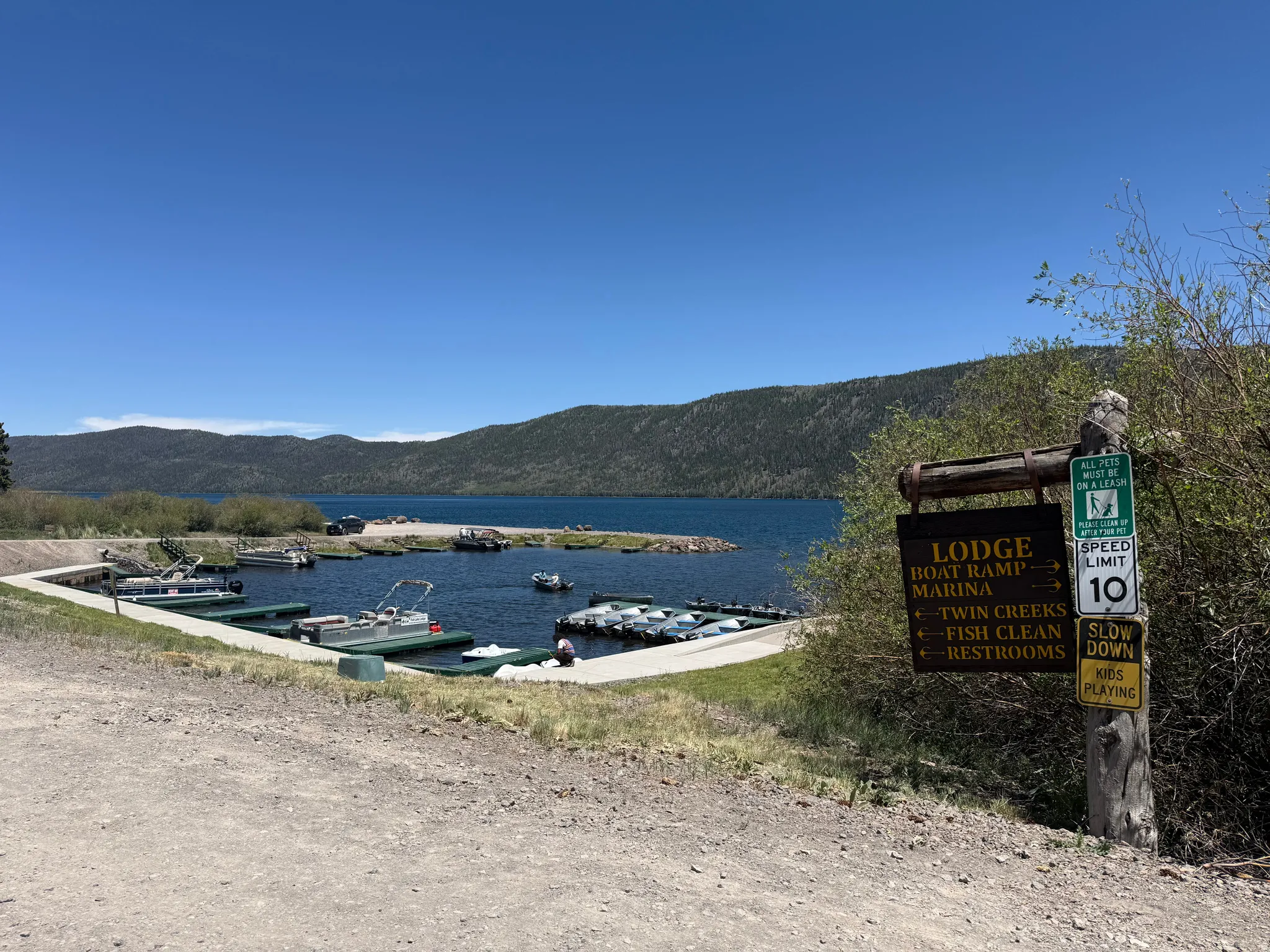 Marina with multiple boat slips and a boat ramp
