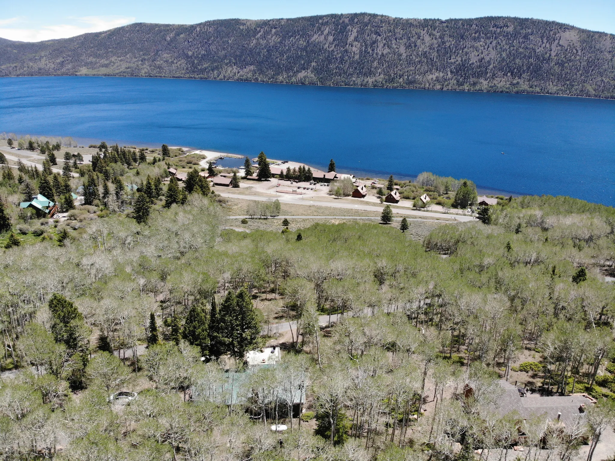 Expansive natural setting featuring a prominent lake and distant mountains