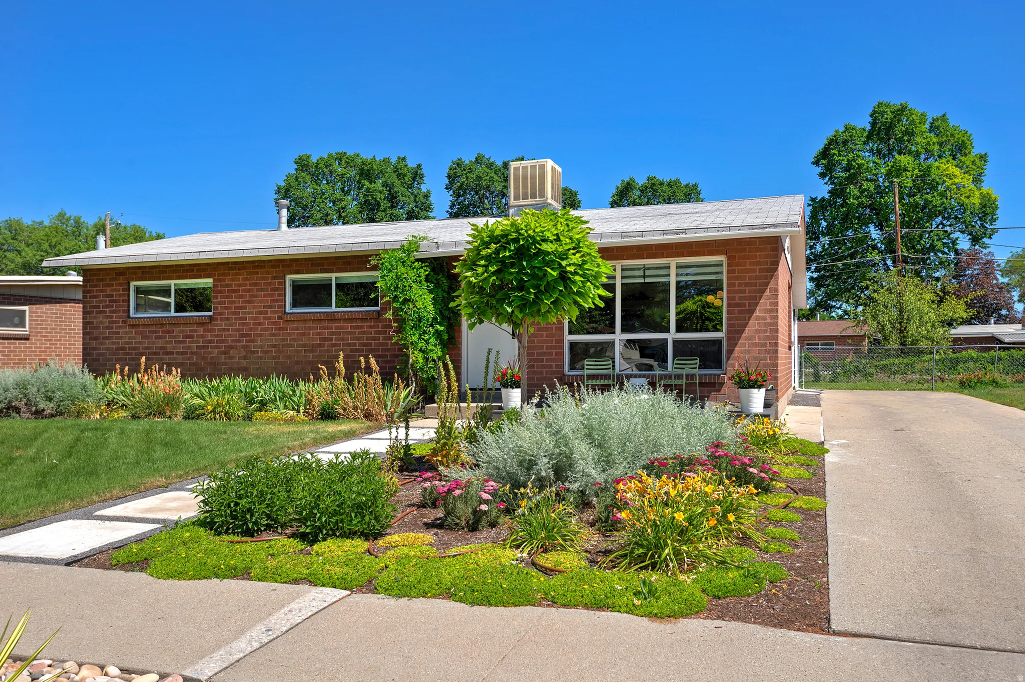Brick exterior residence with a flat roofline