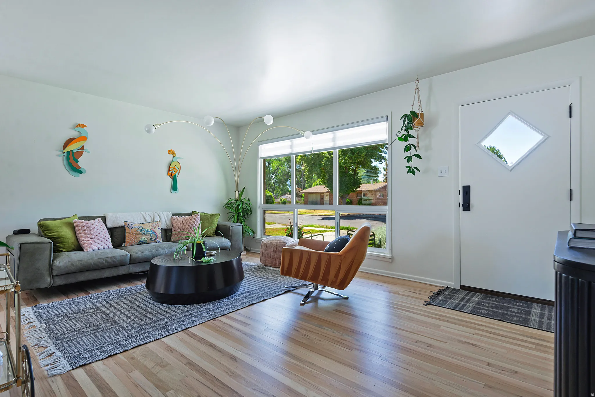Light wood-finish flooring throughout the space