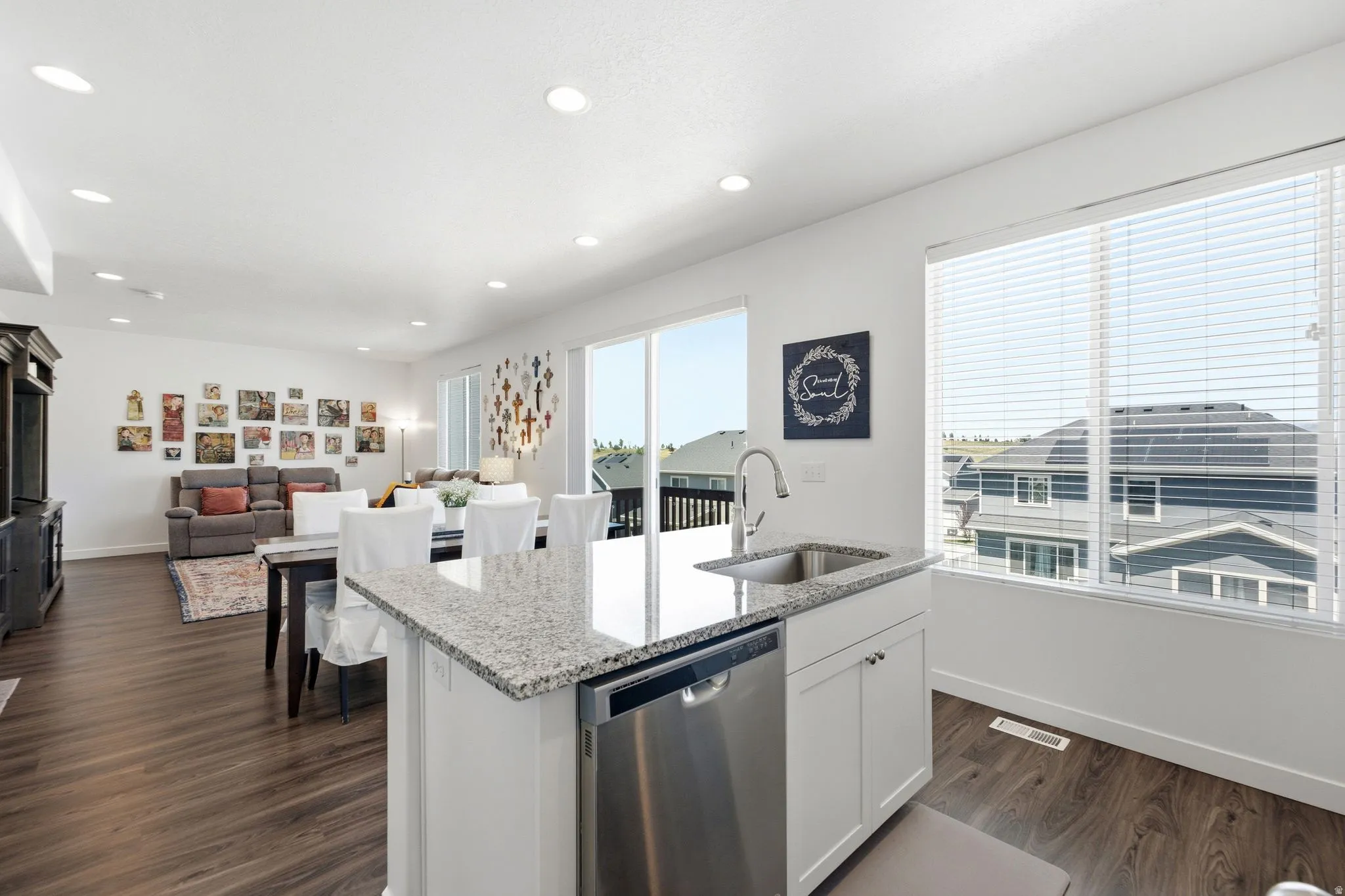 Open concept living space featuring wood-finish flooring throughout