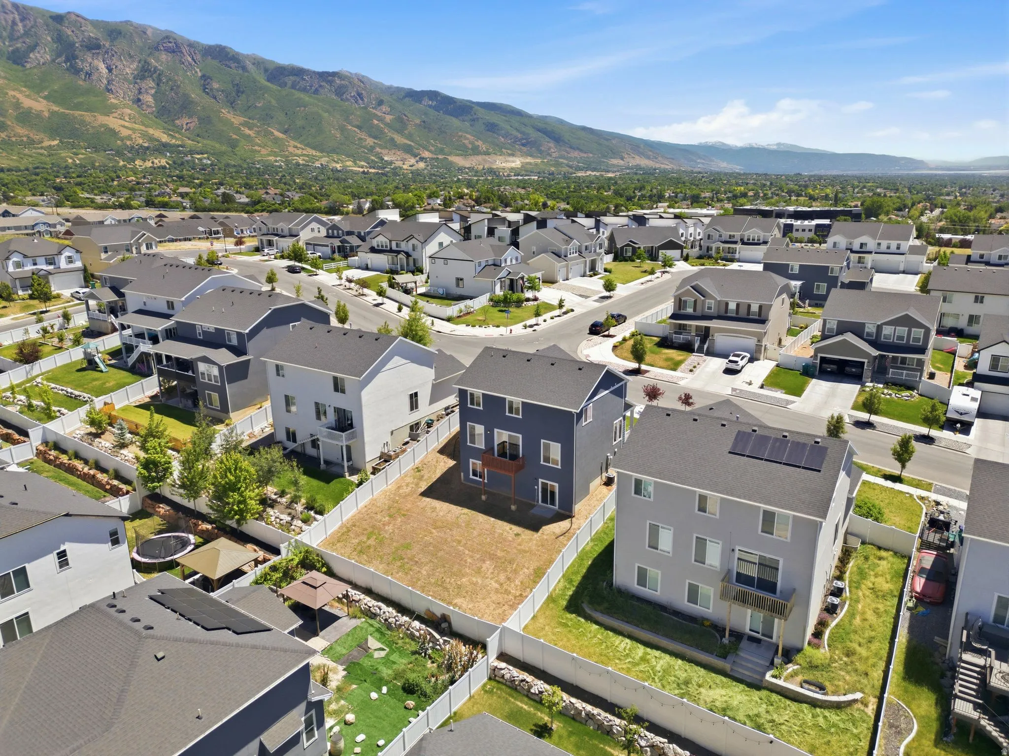 Aerial perspective showcasing residential development with mountain backdrop