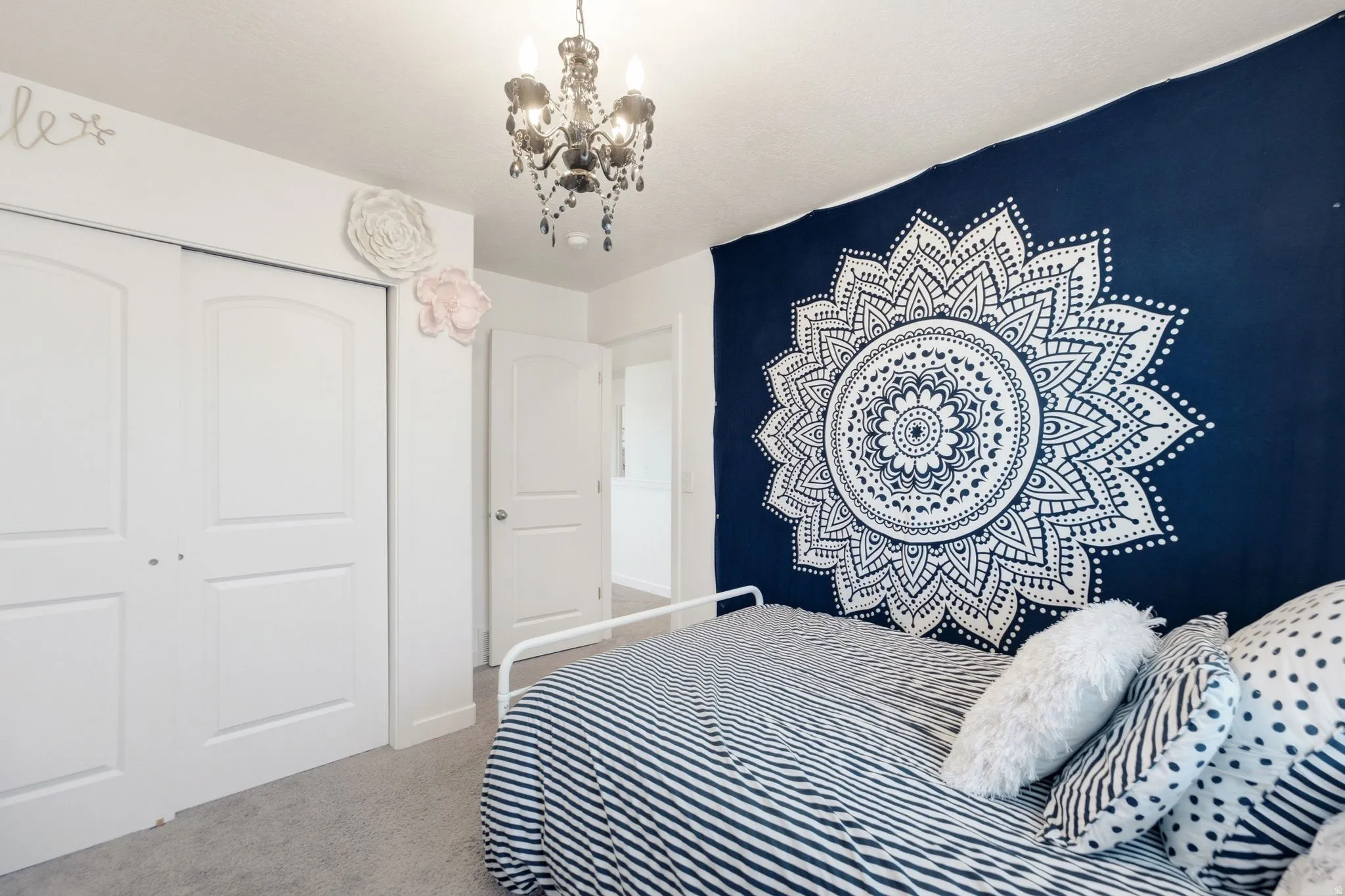 Neutral wall color with a decorative chandelier
