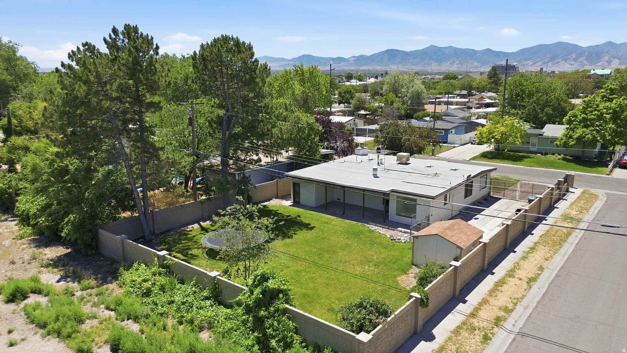 Single-story residence featuring a flat roofline and a covered patio area