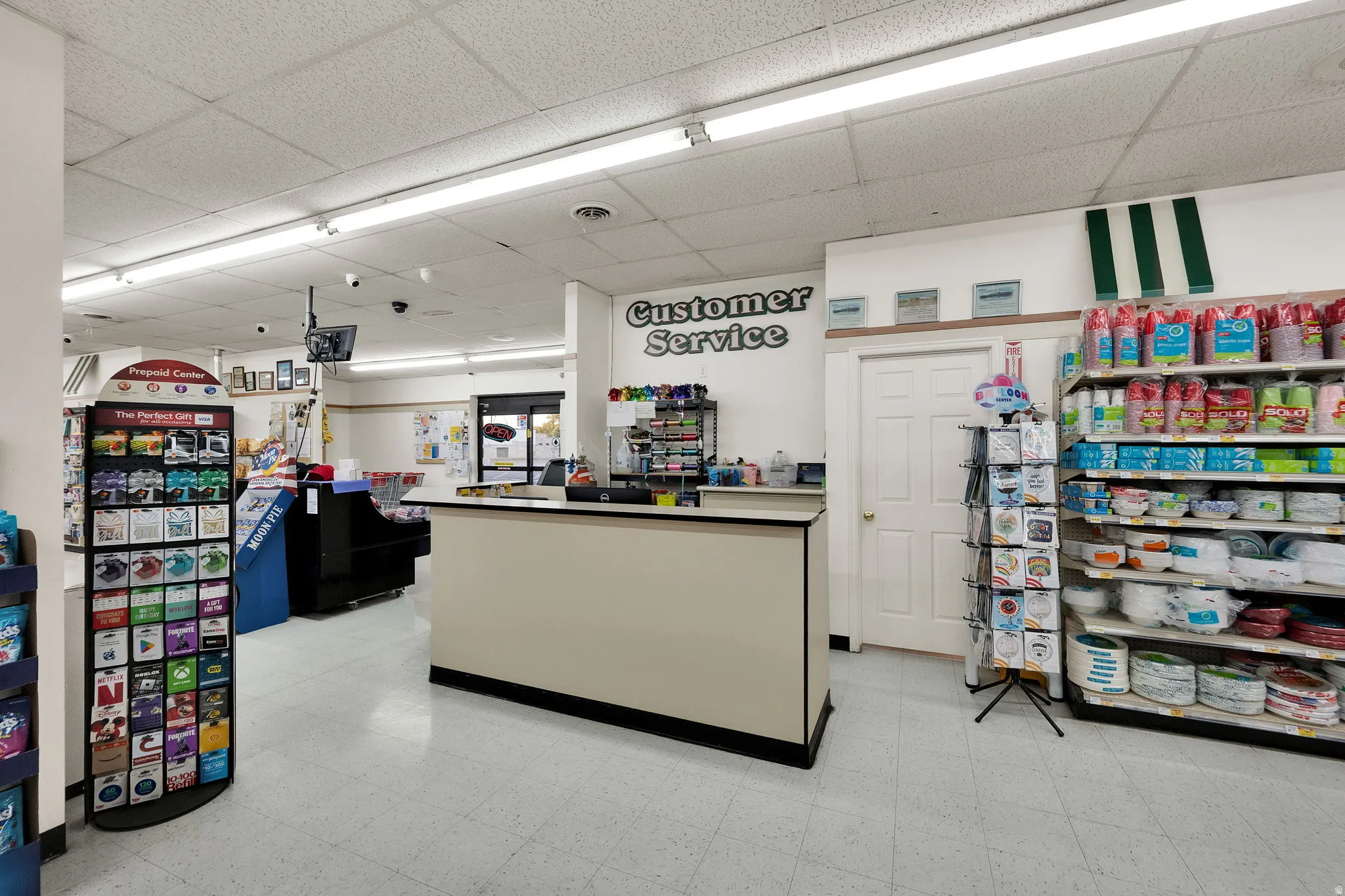 Customer service counter featuring a neutral-toned facade with black trim