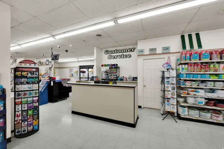 Customer service counter featuring a neutral-toned facade with black trim