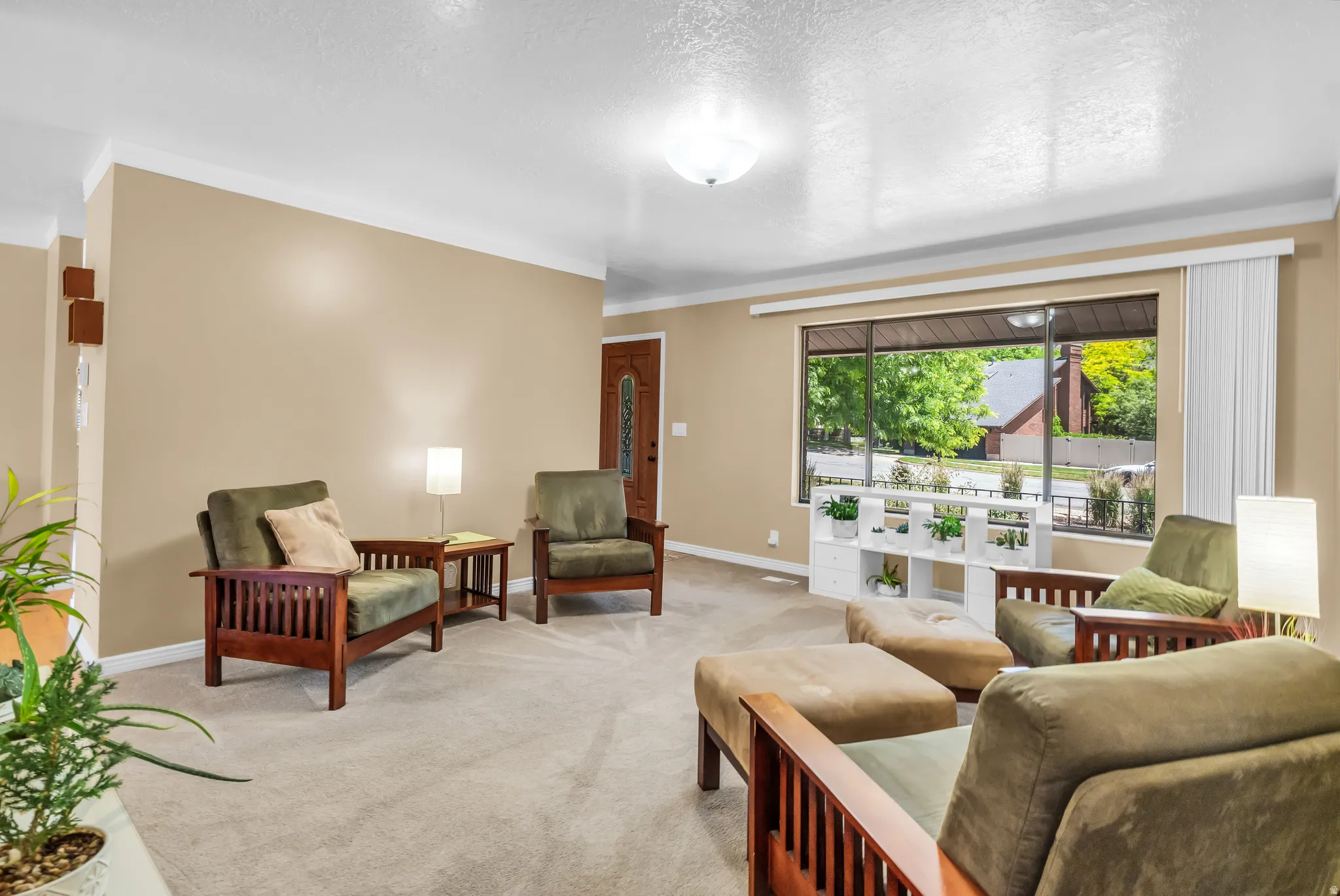 Living area with neutral carpeting and beige wall paint