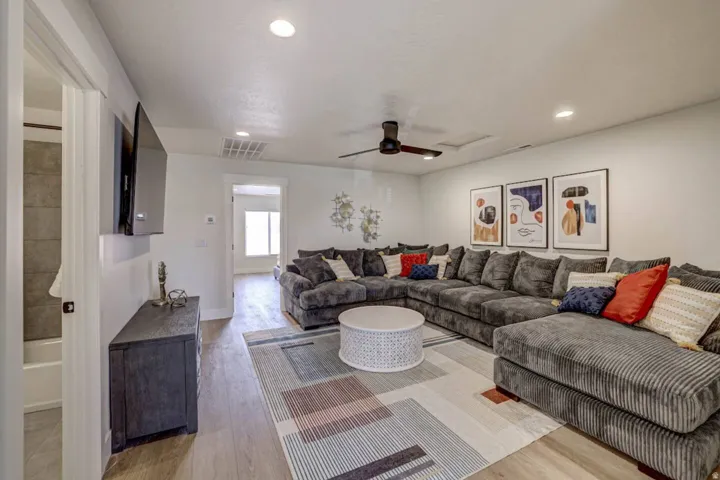 Spacious common area featuring recessed lighting, a ceiling fan, and wood-finish flooring