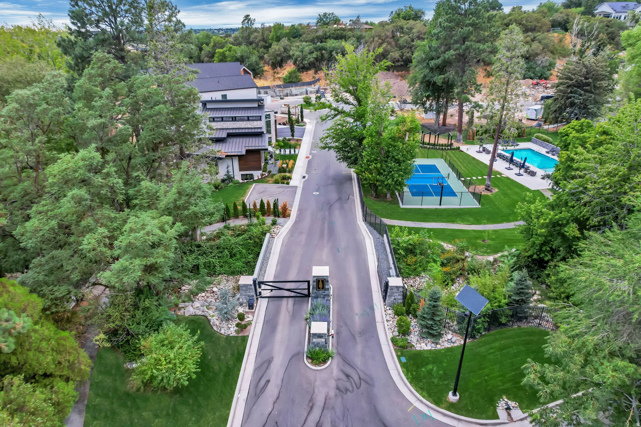 Gated entry road with stone columns