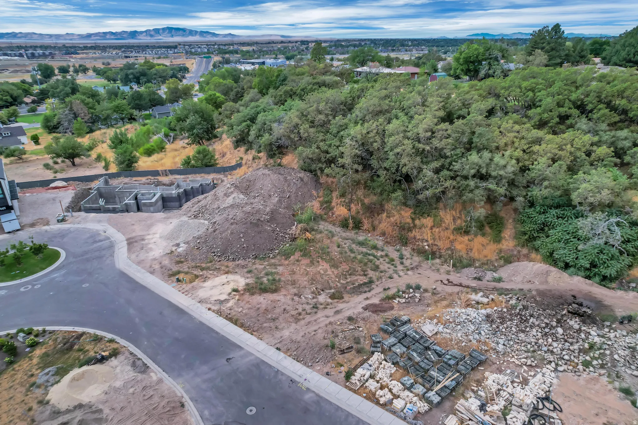 Partially constructed building foundation on a sloped lot