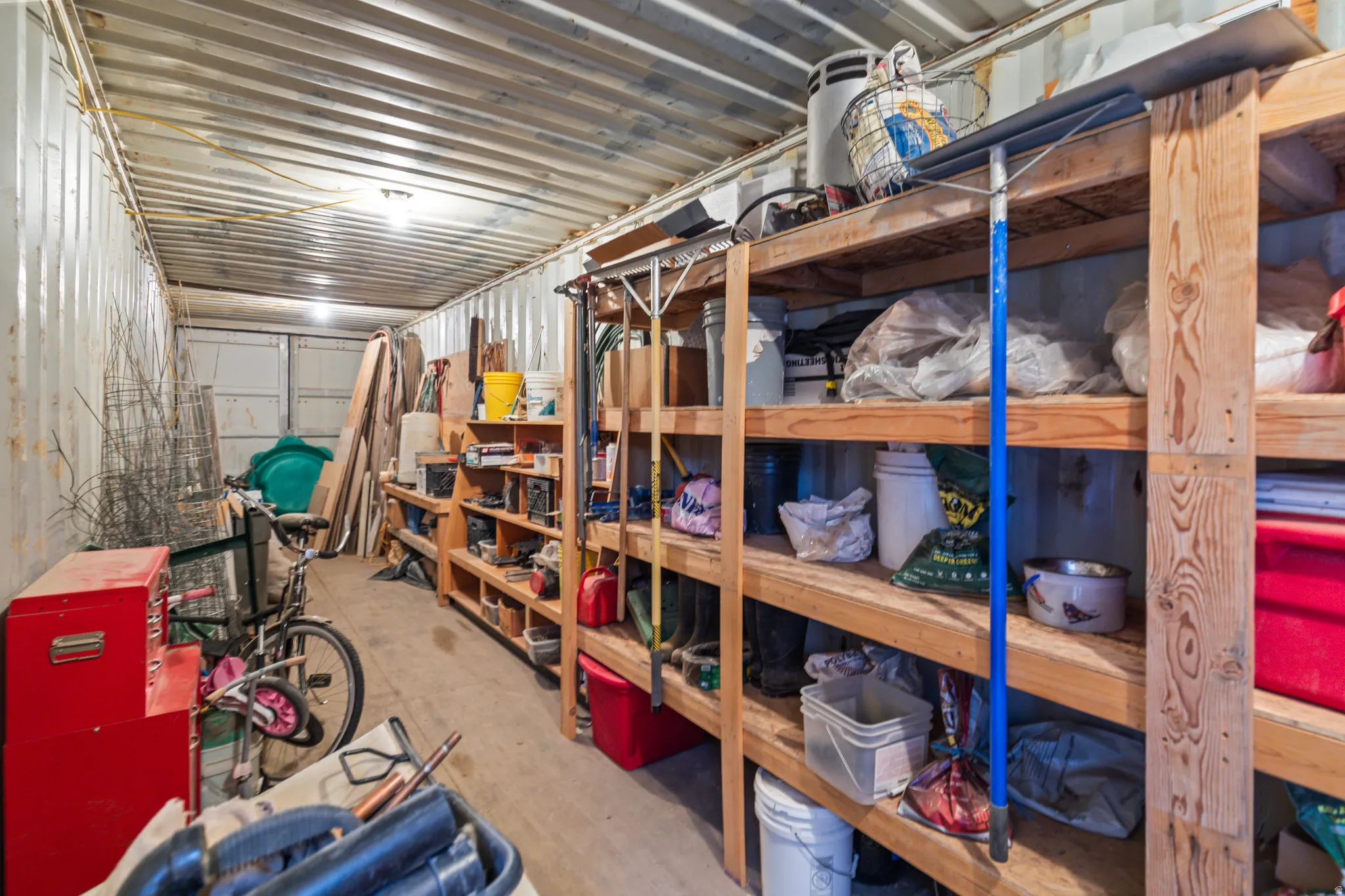 Corrugated metal interior walls and ceiling with multiple light fixtures