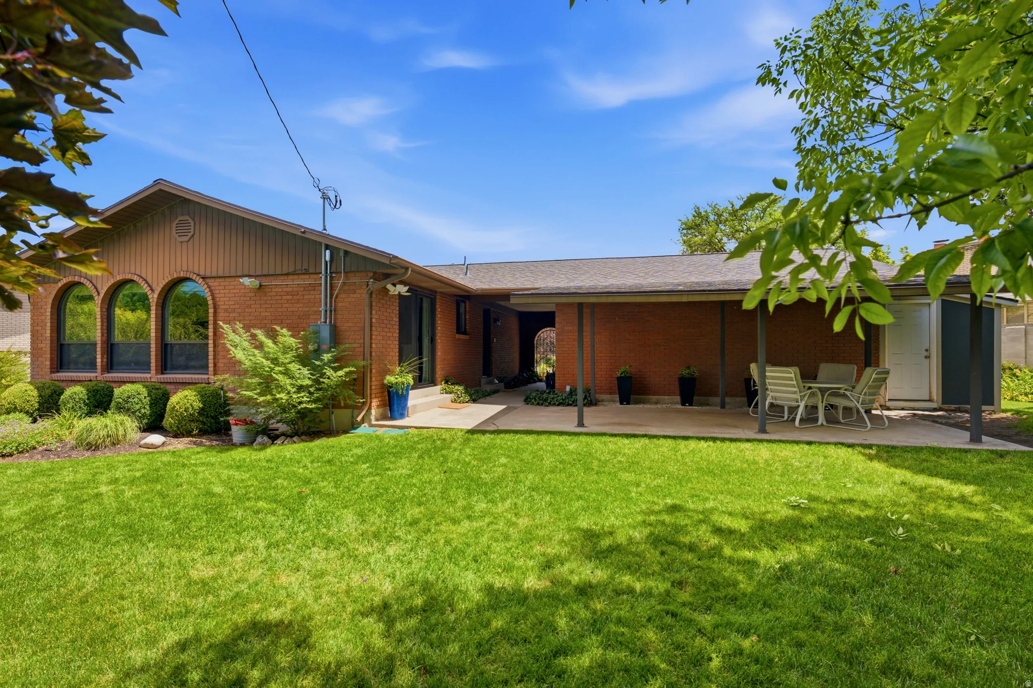 Brick exterior with an expansive green lawn