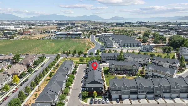 Aerial perspective showcasing a residential development with a mountain backdrop