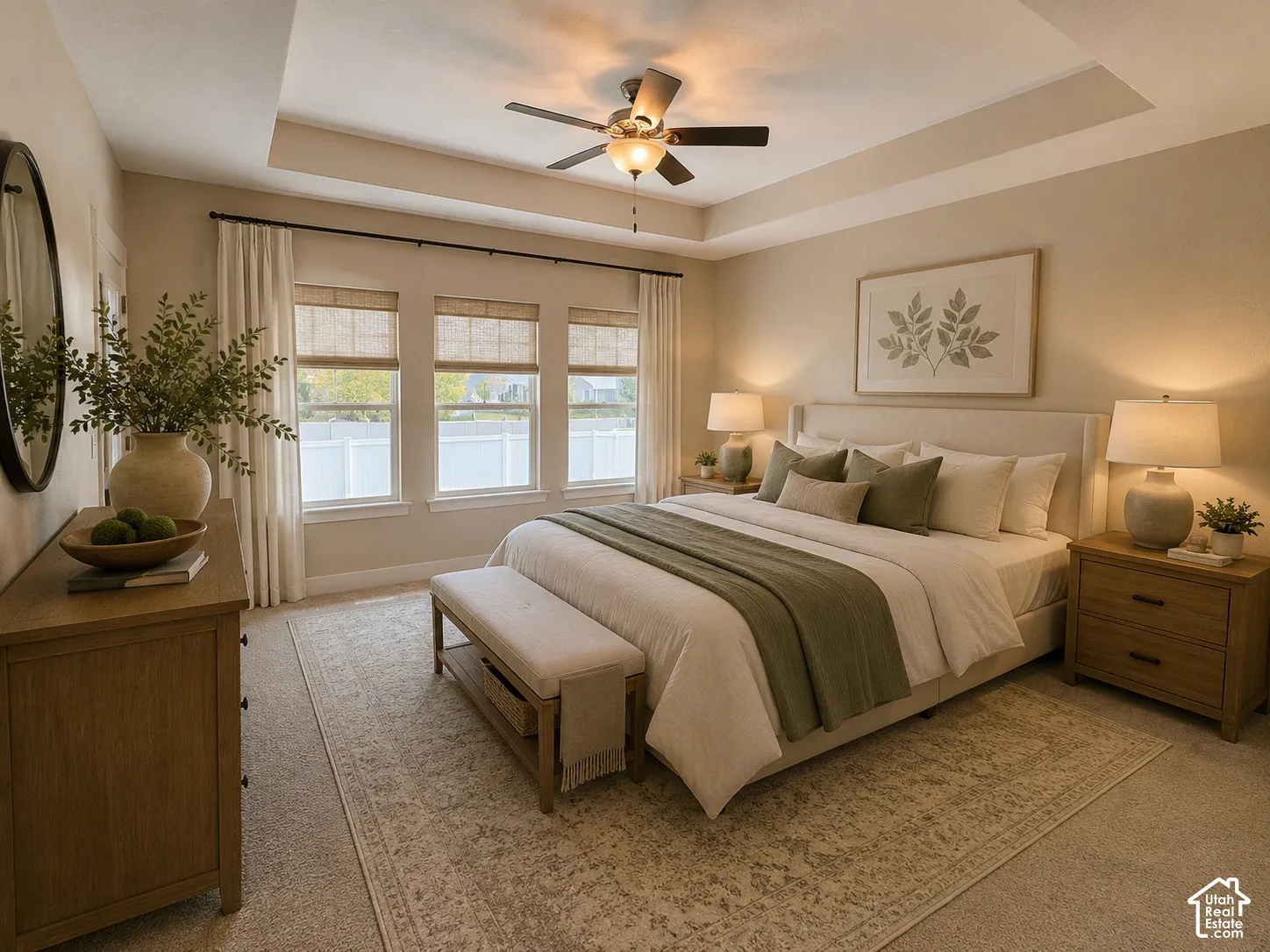 Large master bedroom with access to the deck overlooking the backyard. Ai staged