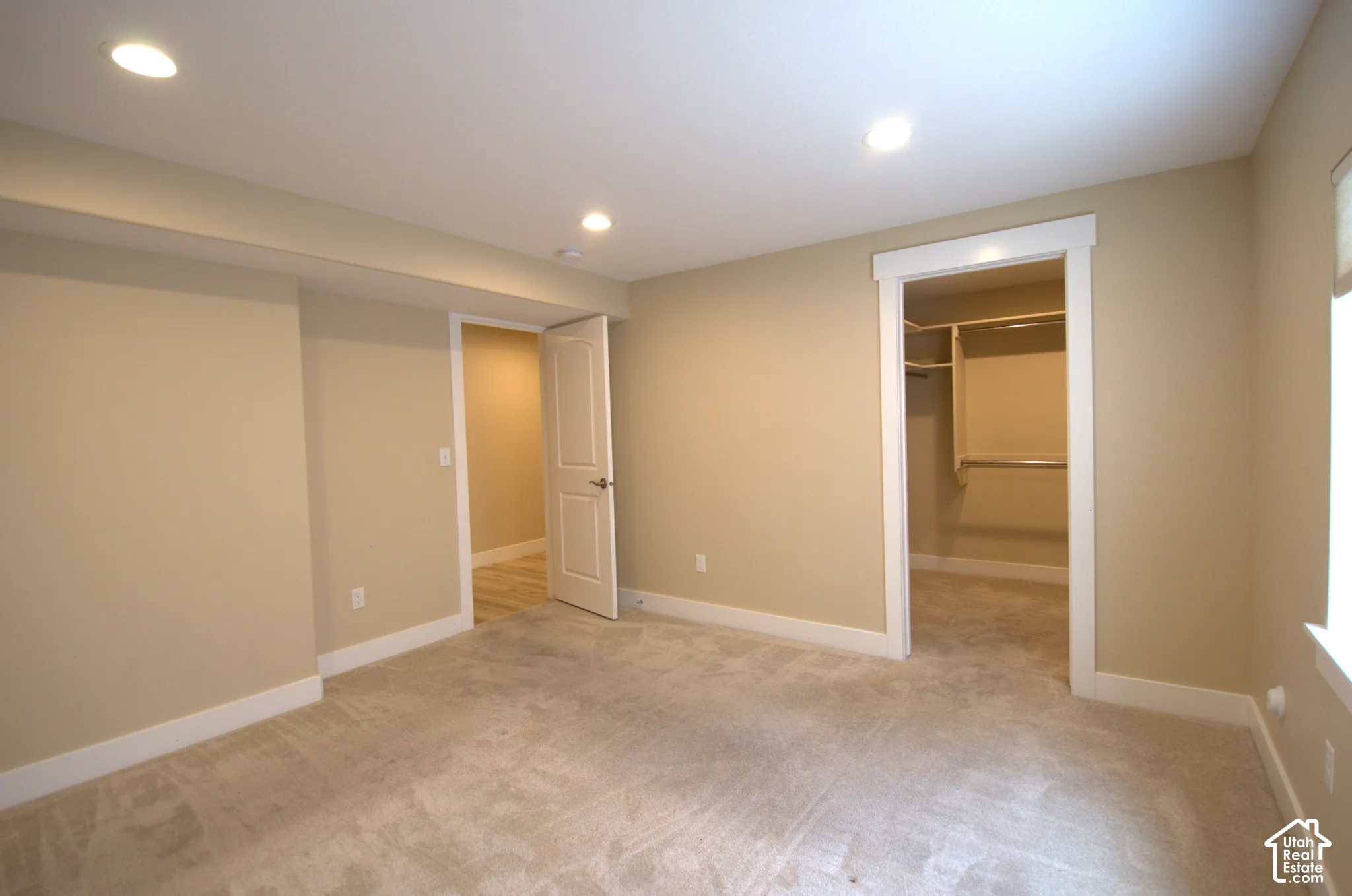 Carpeted room featuring recessed lighting and neutral wall tones