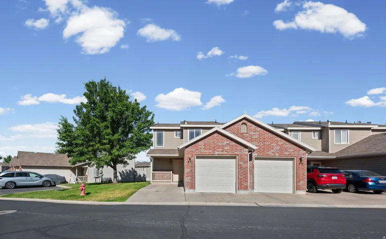 Brick-front townhouse with twin garages