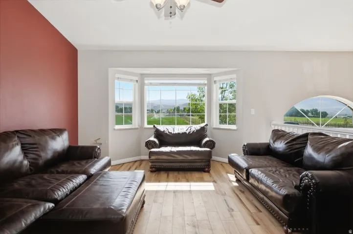 Living space featuring light wood-finish flooring and a distinctive accent wall