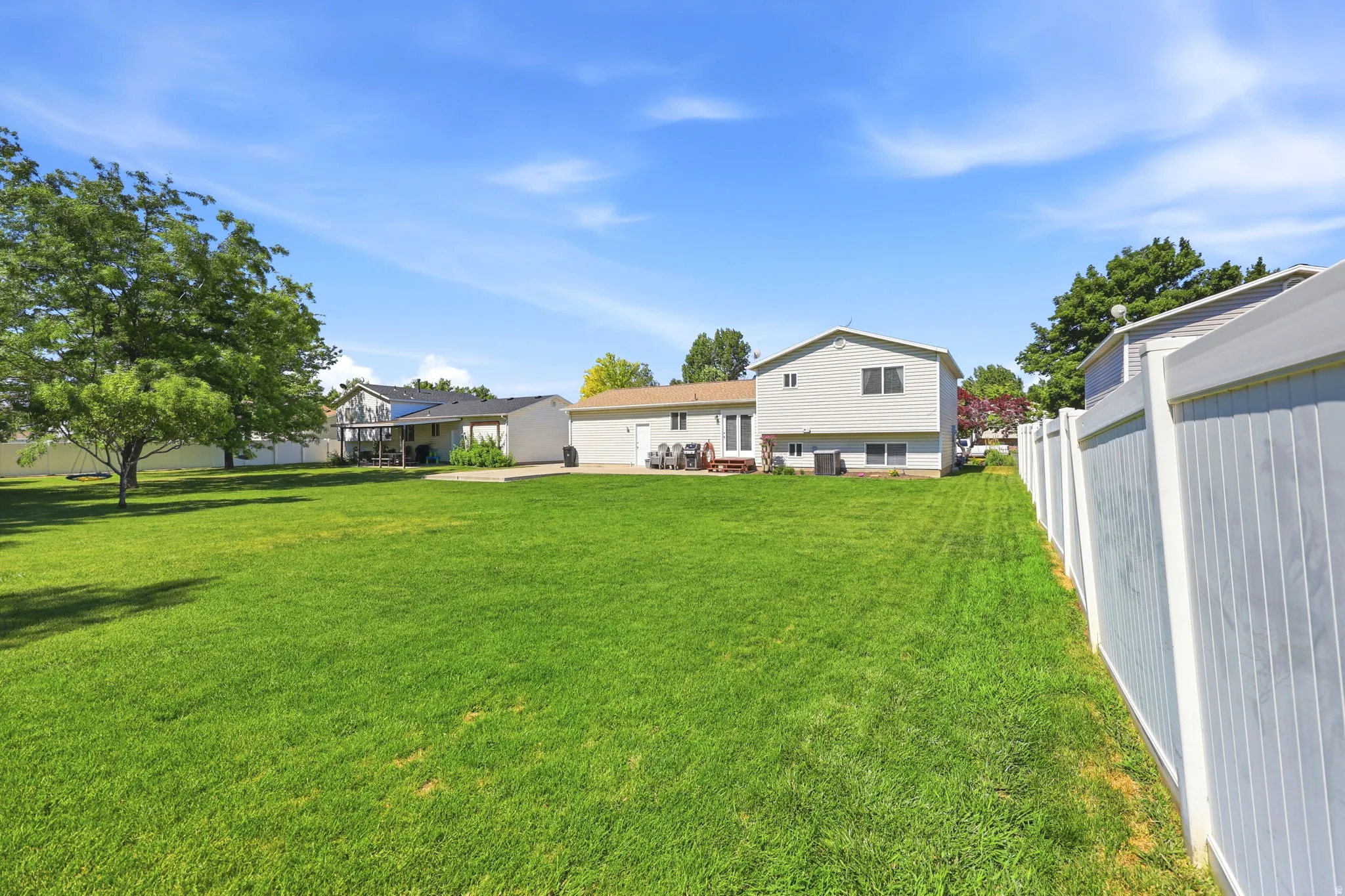 Expansive green lawn providing ample outdoor space