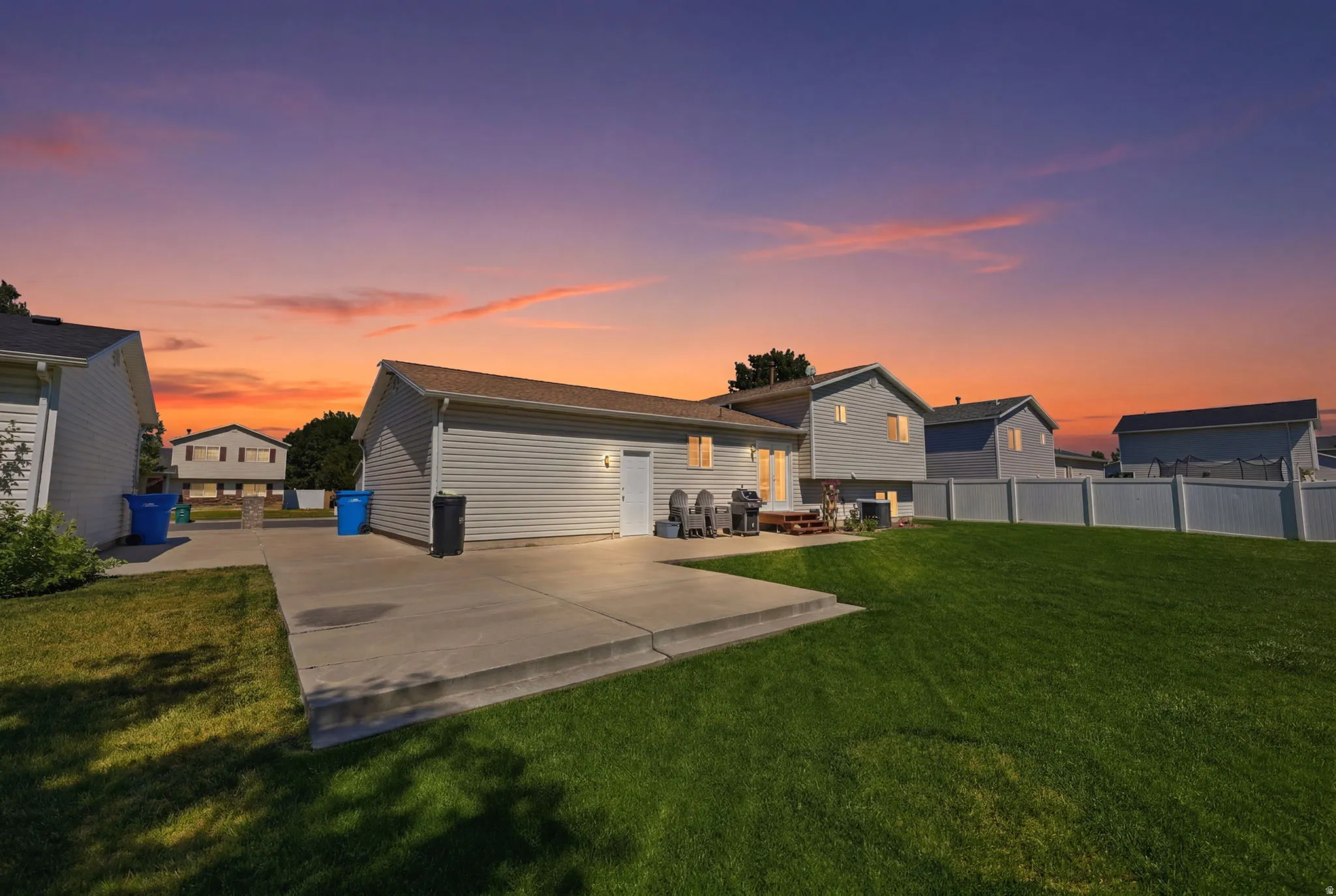 Expansive concrete patio with direct access to the property