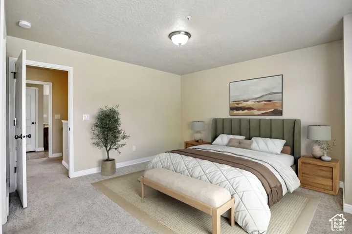 Neutral wall paint, textured ceiling, recessed lighting, and carpeted flooring. Virtually staged.