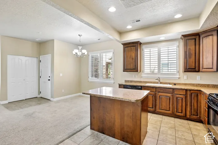 Kitchen featuring wood cabinetry, granite countertops, and a central island