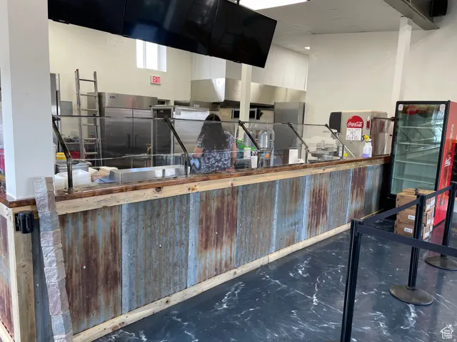 Service counter featuring a distressed corrugated metal and wood-finish facade