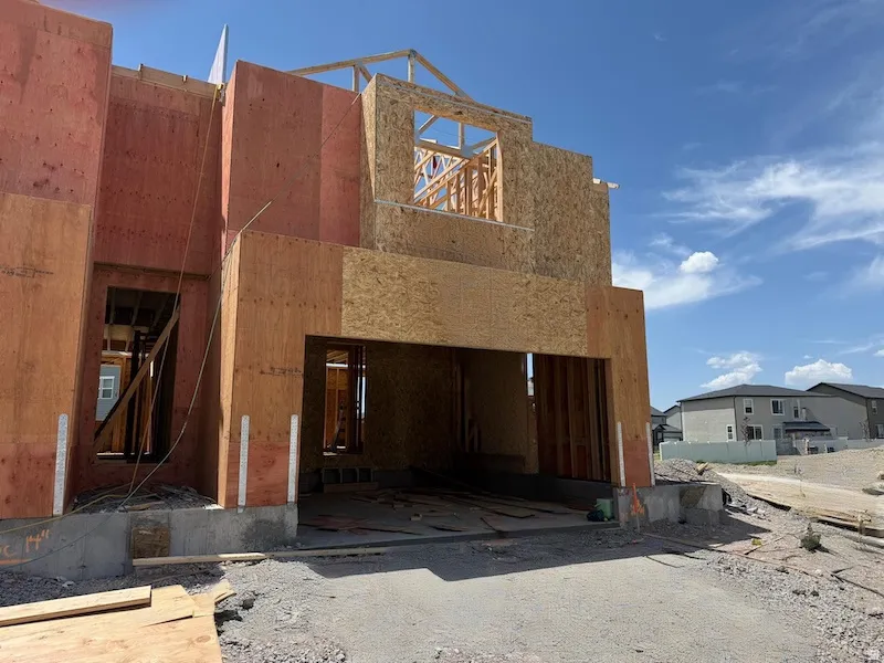 New construction framing with sheathing and exposed trusses