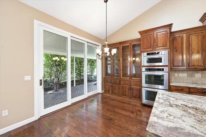 Sliding infinity doors leading to a spa-like backyard.