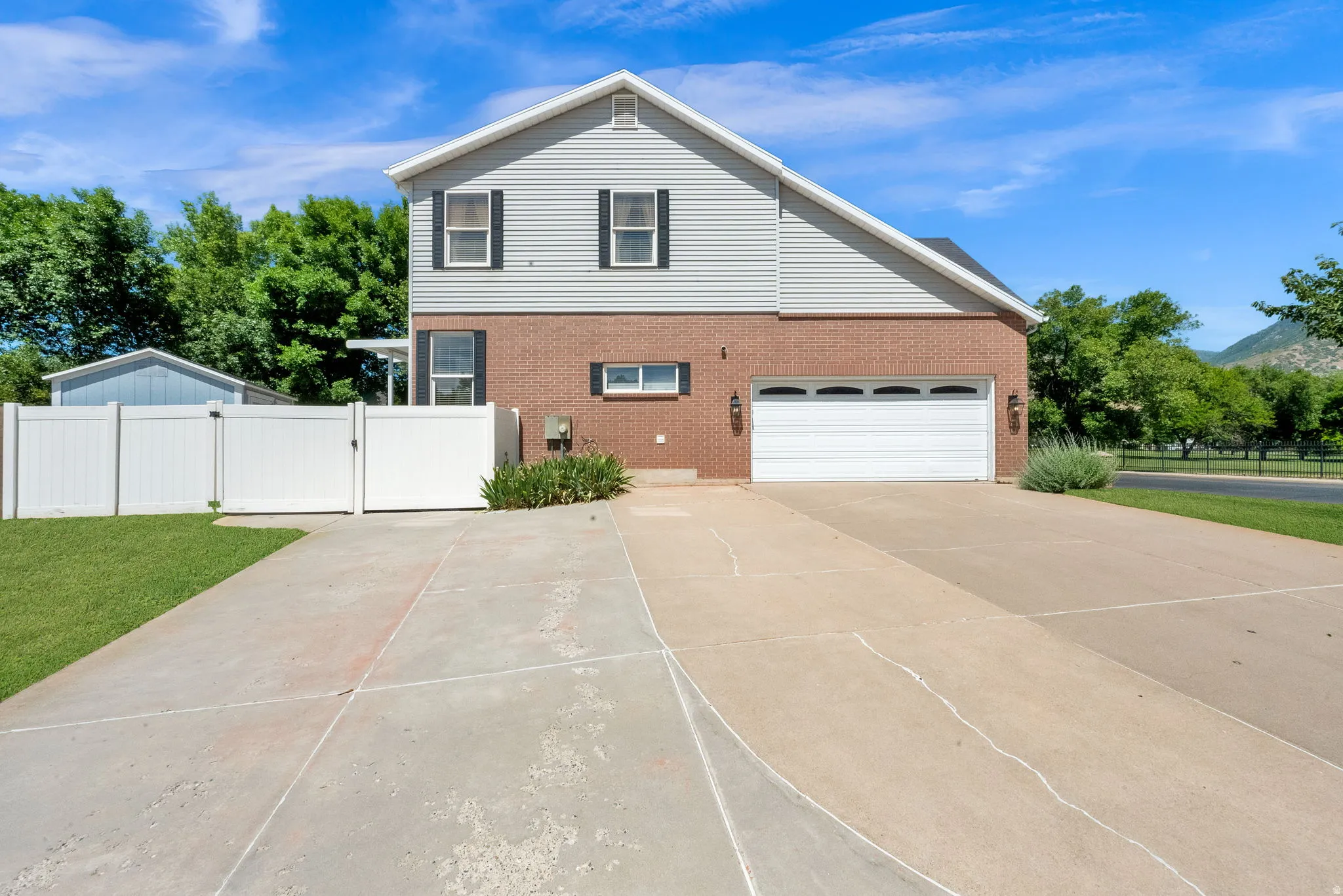 Two-story residence featuring brick and siding exterior