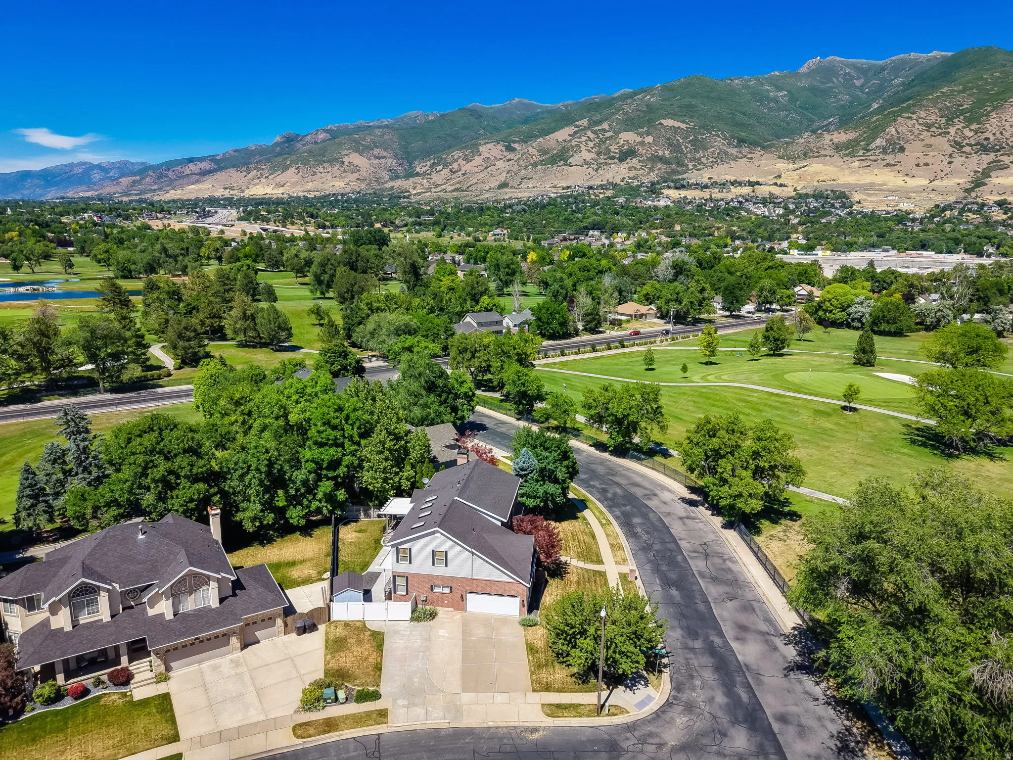 Expansive mountain scenery with surrounding green spaces