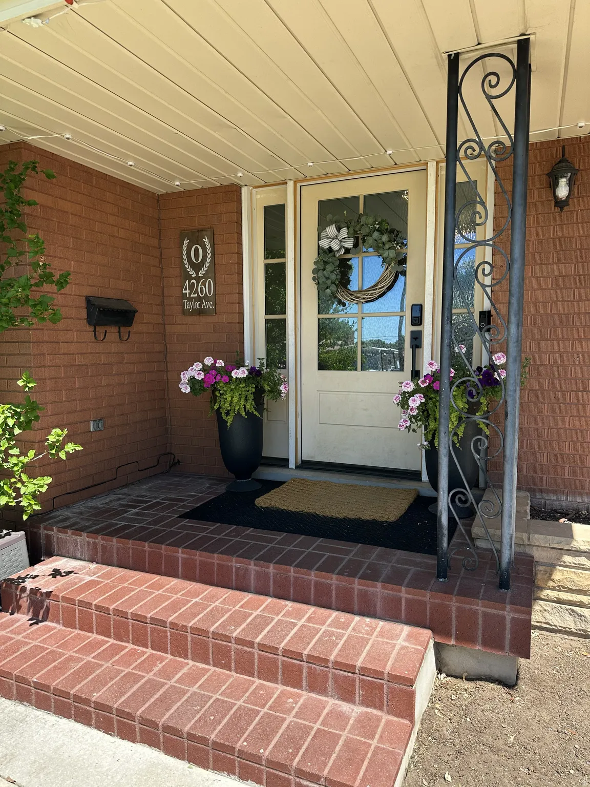 High End Entry Door with Side Lights.  Covered Porch!