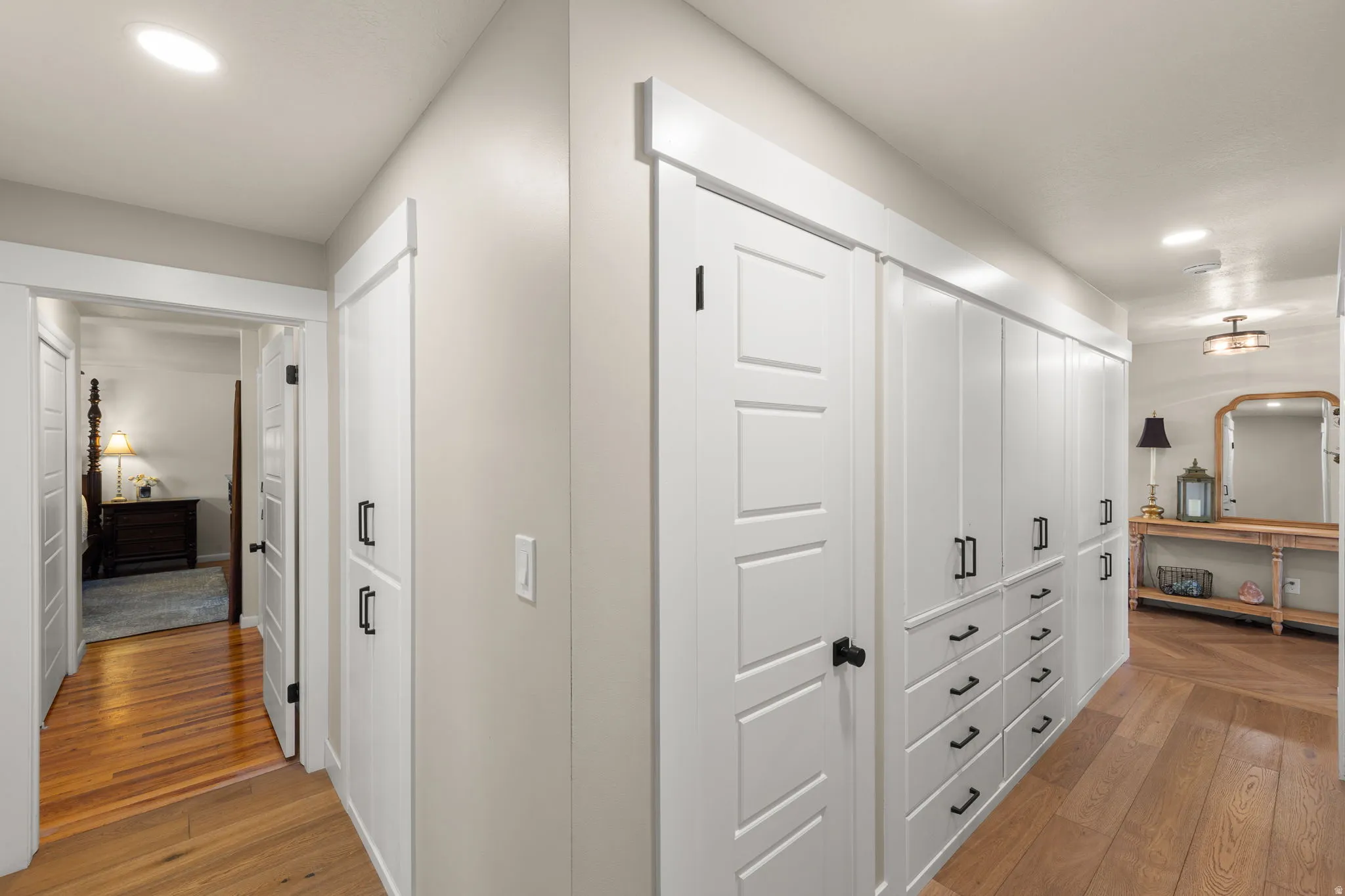 Hallway with several deep drawers and cabinets, and a closet making items accessible and easy to reach & organize.
