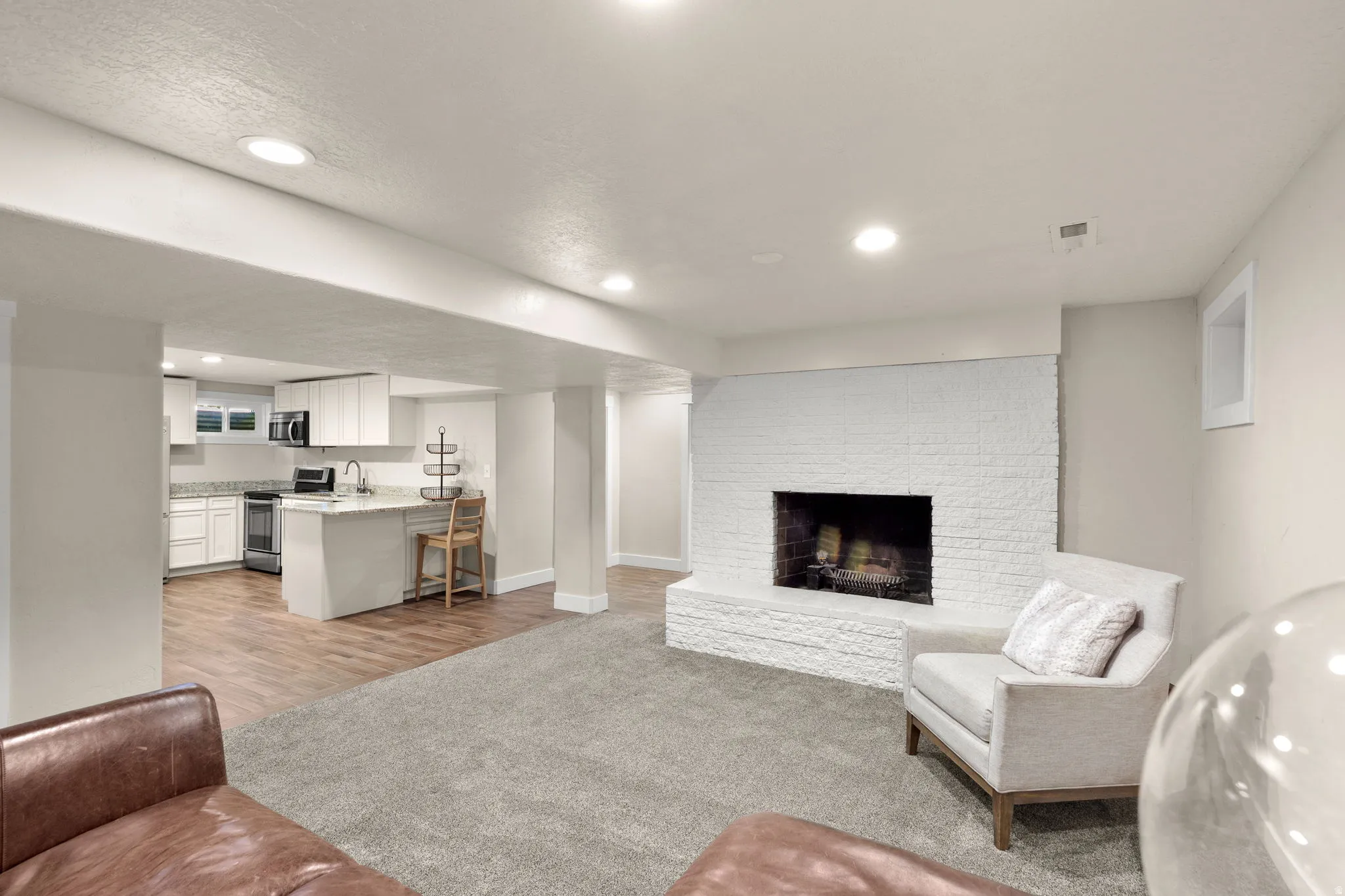 Open Concept Basement Mother in Law Area.  Full Kitchen!  Fire Place!  Utility Room!