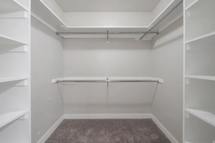 Spacious primary walk-in closet