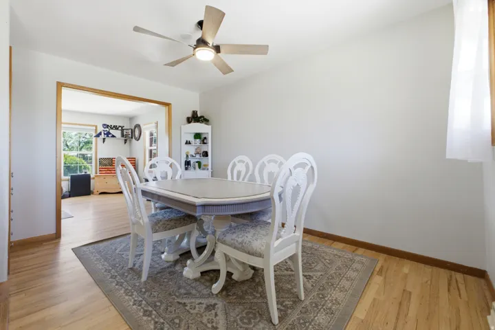 Light wood-finish flooring complements white walls